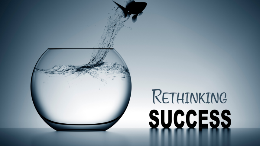 Fish jumping out of a fishbowl to represent rethinking success